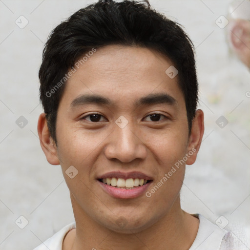 Joyful asian young-adult male with short  black hair and brown eyes