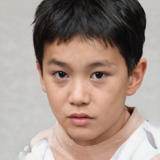 Neutral asian child male with short  brown hair and brown eyes