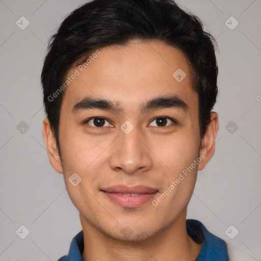 Joyful latino young-adult male with short  brown hair and brown eyes