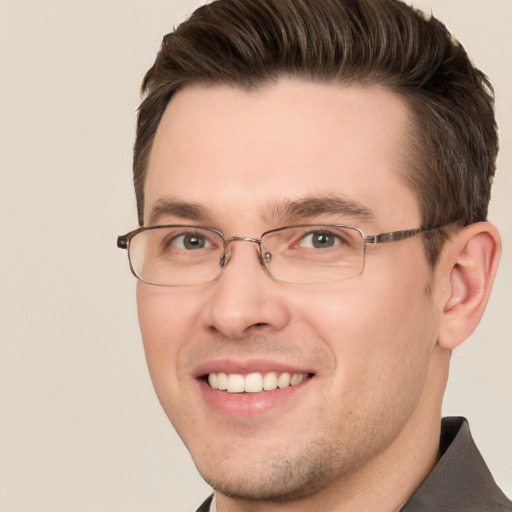 Joyful white young-adult male with short  brown hair and brown eyes