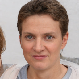 Joyful white adult female with short  brown hair and brown eyes