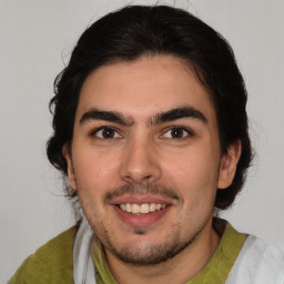 Joyful white young-adult male with medium  brown hair and brown eyes