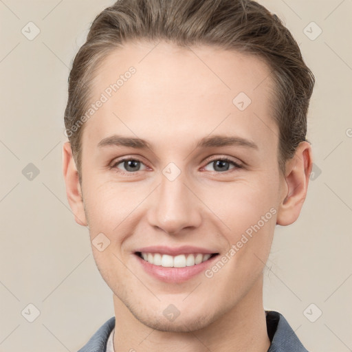 Joyful white young-adult female with short  brown hair and grey eyes