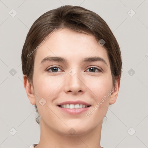 Joyful white young-adult female with short  brown hair and grey eyes