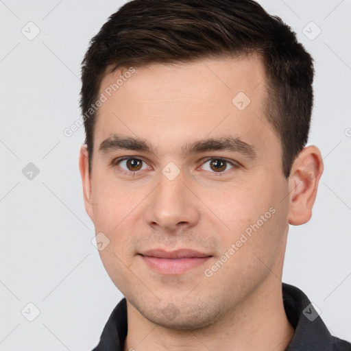 Joyful white young-adult male with short  brown hair and brown eyes