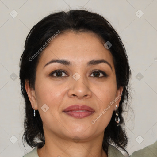 Joyful latino adult female with medium  brown hair and brown eyes