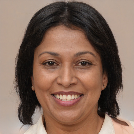 Joyful asian adult female with medium  brown hair and brown eyes