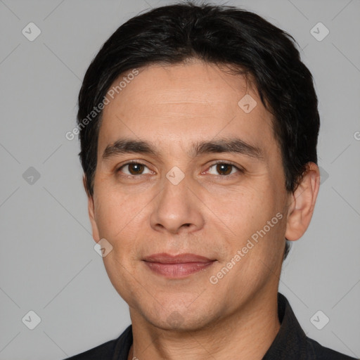 Joyful white adult male with short  black hair and brown eyes