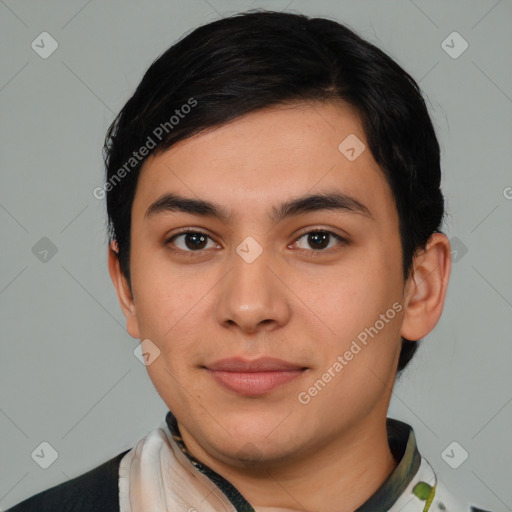 Joyful latino young-adult male with short  black hair and brown eyes