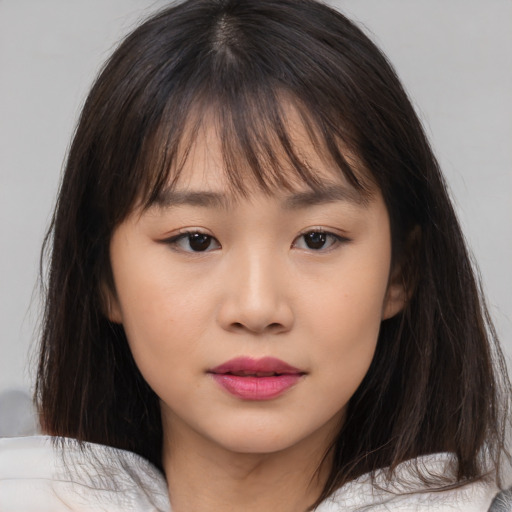 Neutral asian child female with medium  brown hair and brown eyes