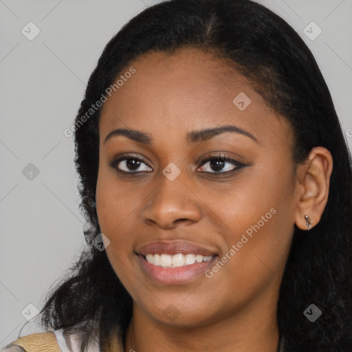 Joyful latino young-adult female with long  black hair and brown eyes