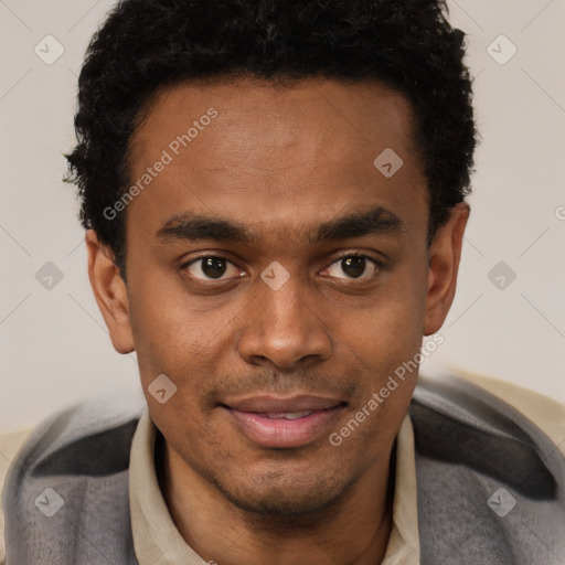 Joyful black young-adult male with short  brown hair and brown eyes