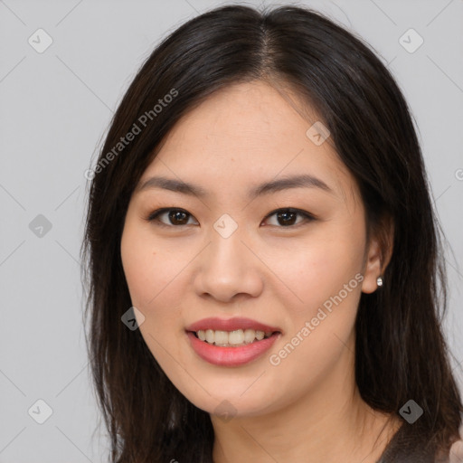 Joyful asian young-adult female with long  brown hair and brown eyes