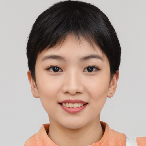 Joyful asian young-adult female with short  black hair and brown eyes