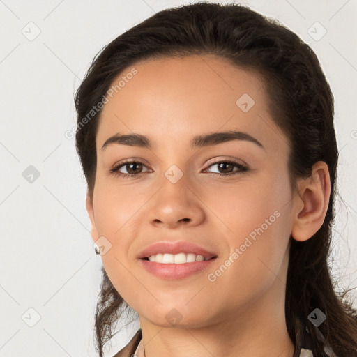 Joyful white young-adult female with long  brown hair and brown eyes