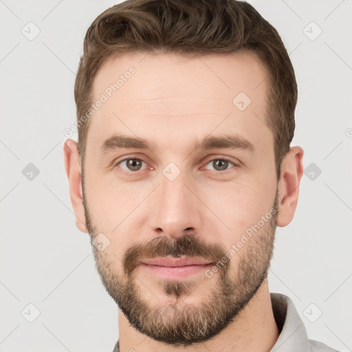 Neutral white young-adult male with short  brown hair and grey eyes