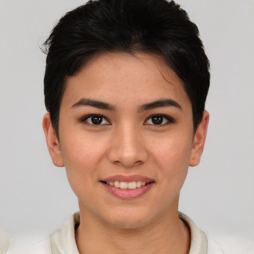 Joyful asian young-adult female with short  brown hair and brown eyes