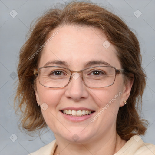 Joyful white adult female with medium  brown hair and blue eyes