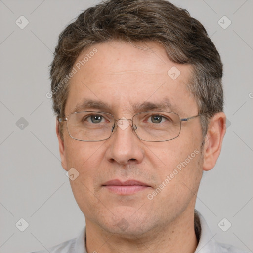 Joyful white middle-aged male with short  brown hair and brown eyes