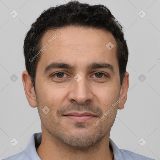 Joyful white young-adult male with short  black hair and brown eyes