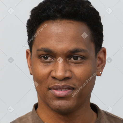 Joyful black young-adult male with short  black hair and brown eyes