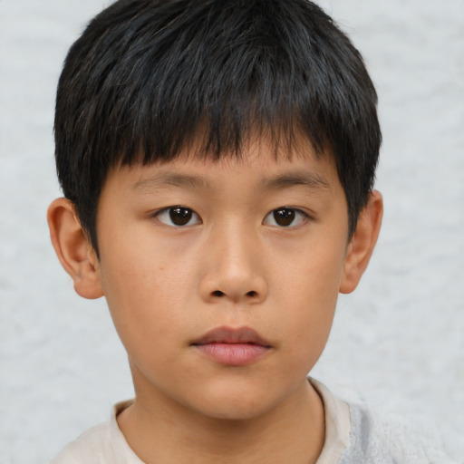 Neutral asian child male with short  brown hair and brown eyes