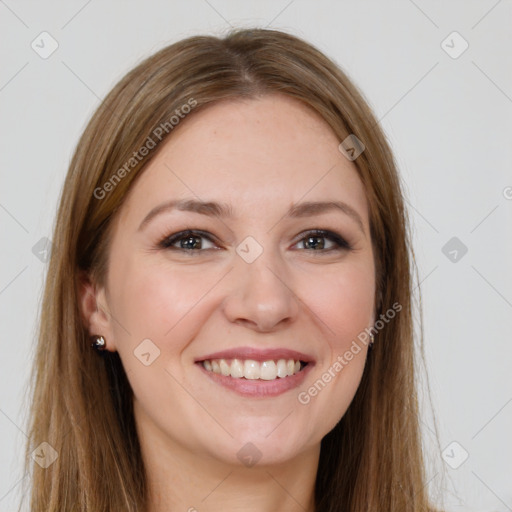 Joyful white young-adult female with long  brown hair and brown eyes