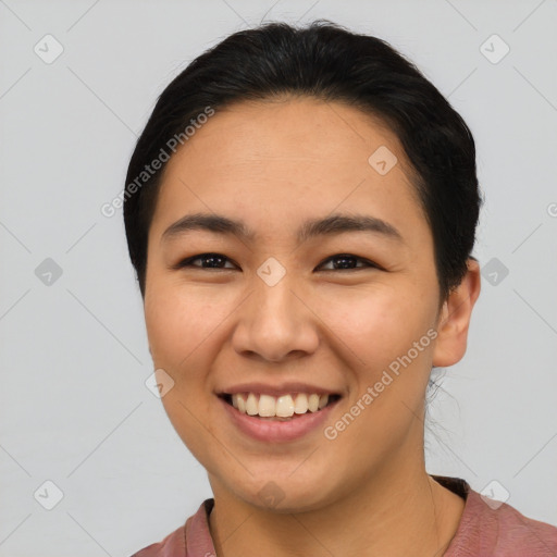 Joyful asian young-adult female with short  brown hair and brown eyes