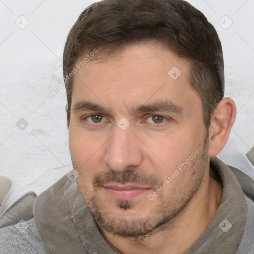 Joyful white adult male with short  brown hair and brown eyes