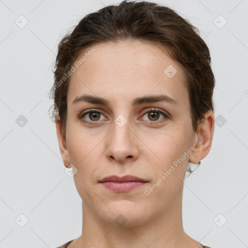 Neutral white young-adult female with short  brown hair and grey eyes