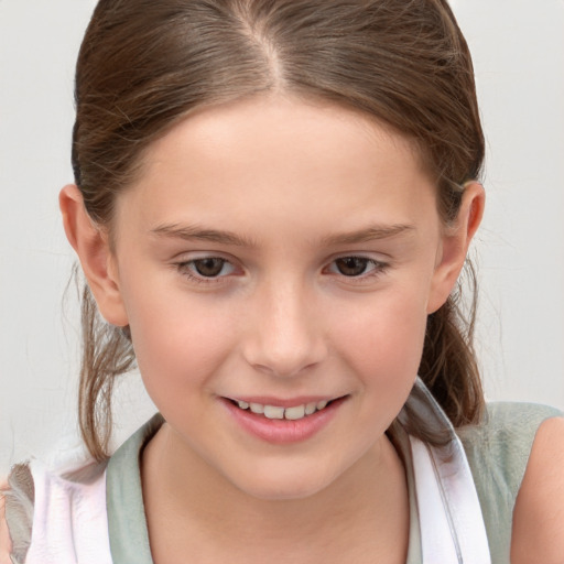 Joyful white child female with medium  brown hair and brown eyes