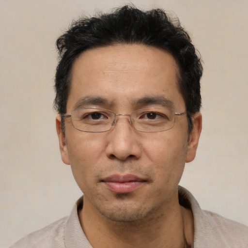 Neutral asian adult male with short  black hair and brown eyes