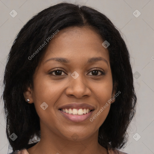 Joyful black young-adult female with medium  brown hair and brown eyes