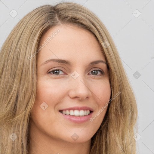 Joyful white young-adult female with long  brown hair and green eyes