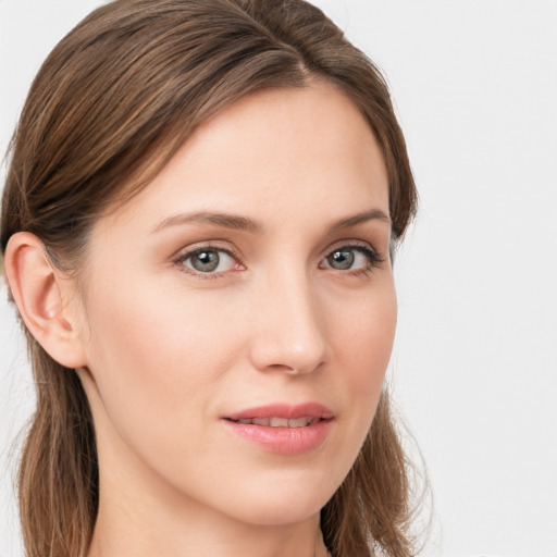 Joyful white young-adult female with long  brown hair and grey eyes