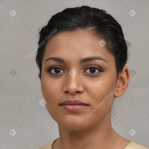 Joyful latino young-adult female with short  brown hair and brown eyes