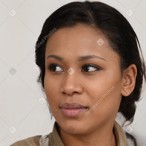 Joyful latino young-adult female with medium  brown hair and brown eyes