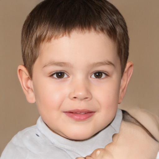 Joyful white child male with short  brown hair and brown eyes