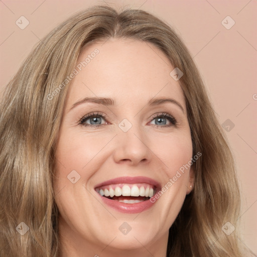 Joyful white young-adult female with long  brown hair and green eyes