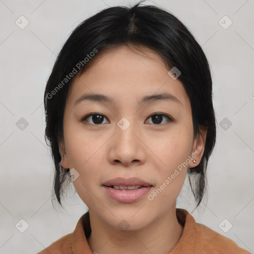 Joyful asian young-adult female with medium  black hair and brown eyes