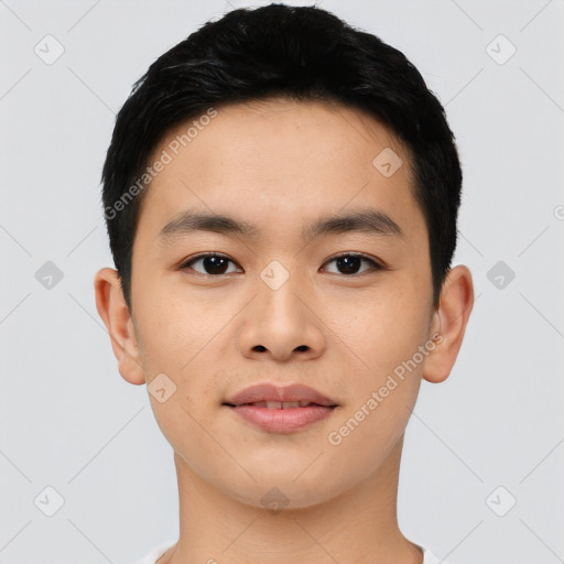 Joyful asian young-adult male with short  black hair and brown eyes