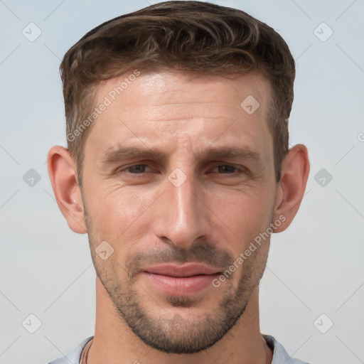 Joyful white adult male with short  brown hair and grey eyes