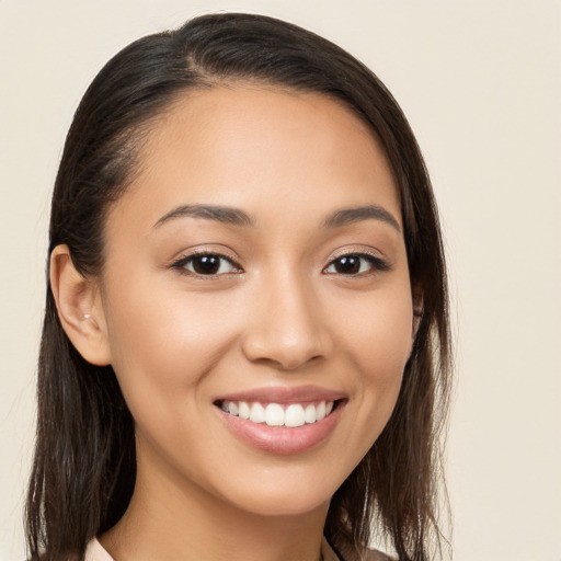 Joyful white young-adult female with long  brown hair and brown eyes