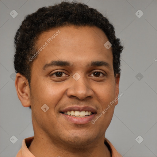 Joyful latino young-adult male with short  brown hair and brown eyes