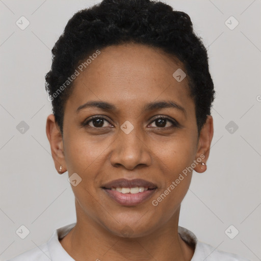 Joyful black young-adult female with short  black hair and brown eyes