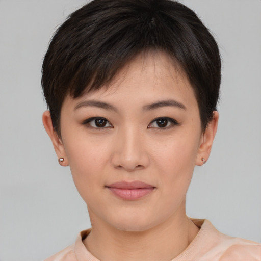 Joyful asian young-adult female with short  brown hair and brown eyes