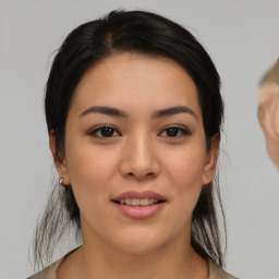 Joyful asian young-adult female with medium  black hair and brown eyes