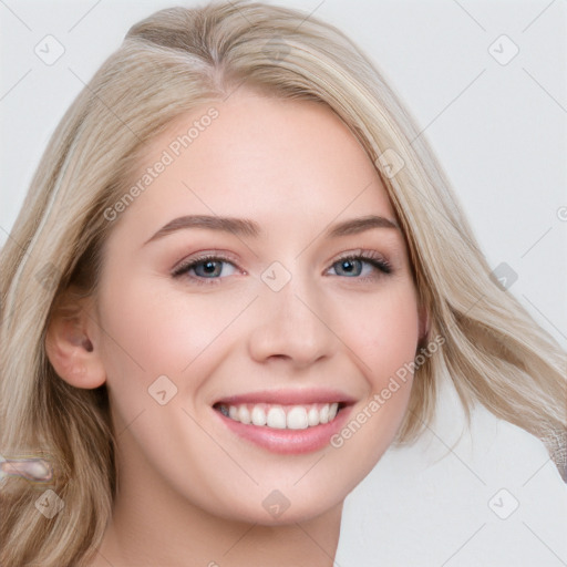 Joyful white young-adult female with long  brown hair and blue eyes