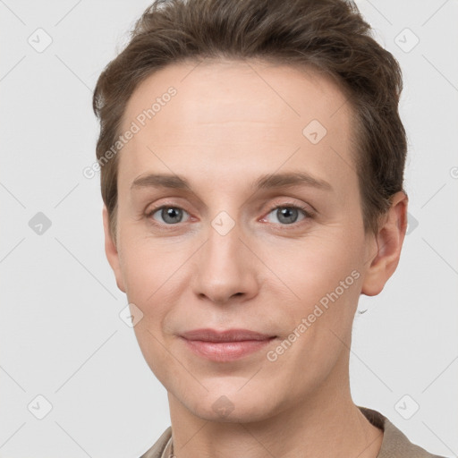 Joyful white young-adult female with short  brown hair and grey eyes