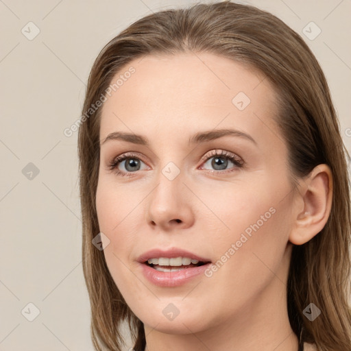 Joyful white young-adult female with medium  brown hair and grey eyes